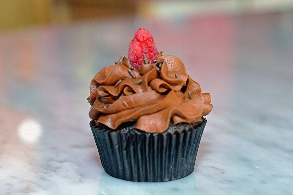 Chocolate cupcake with raspberry topper